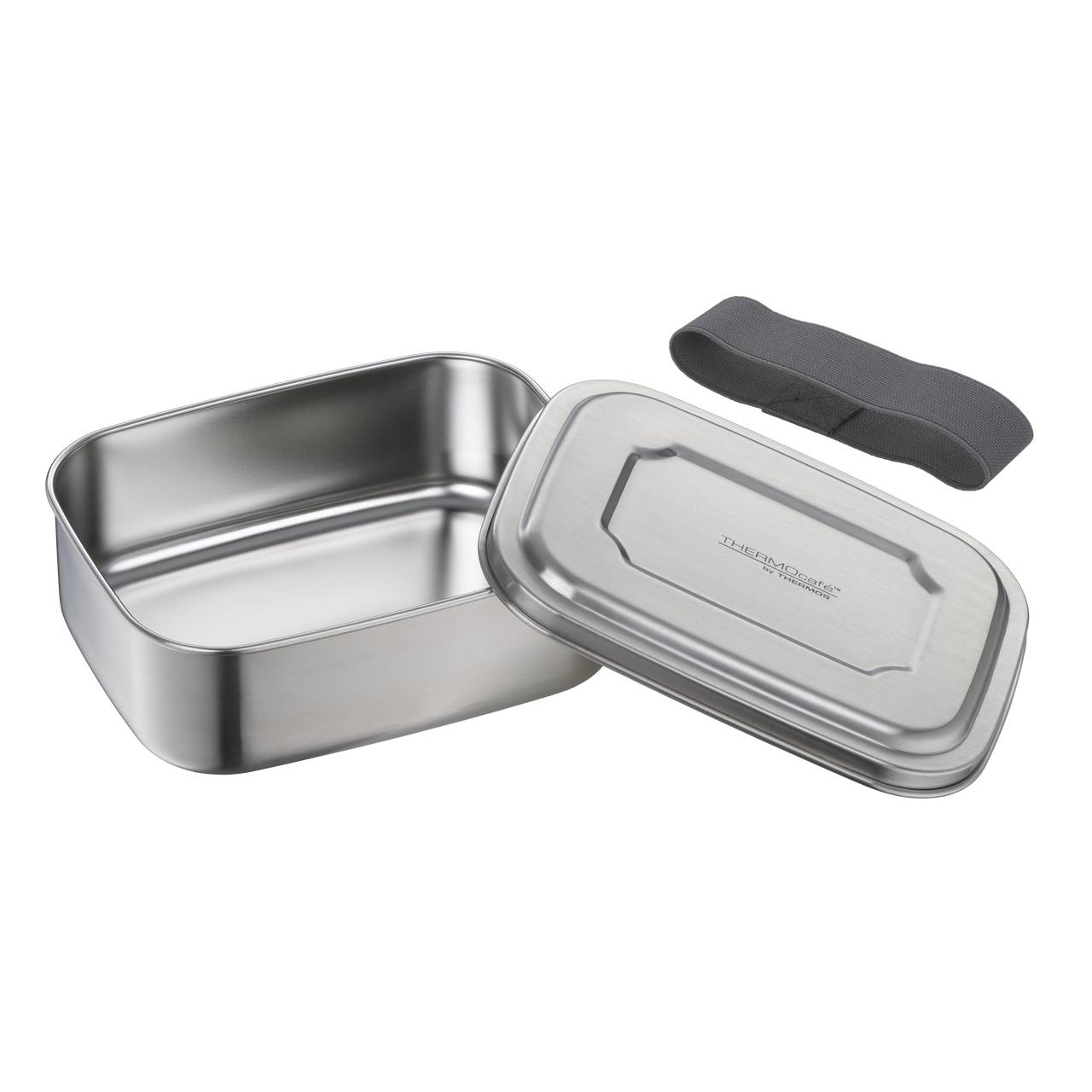 Die rechteckige Edelstahl-Lunchbox ist offen, daneben liegen der Deckel und ein schwarzes Gummiband. Die Box wirkt robust und funktional.