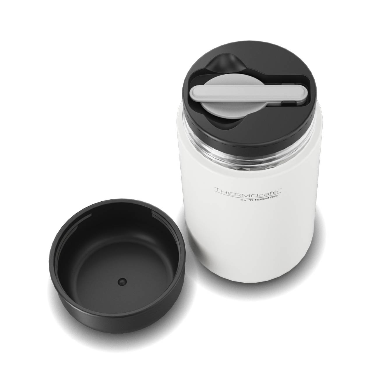 Das Bild zeigt ein weißer Thermobehälter mit schwarzem Deckel, der abgenommen neben der Kanne liegt. Auf der Kanne ist der Schriftzug "THERMOcafe by Thermos" zu sehen. Der Deckel scheint eine Art Griff oder Verschlussmechanismus zu haben.